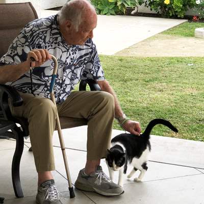 Elderly man with cat