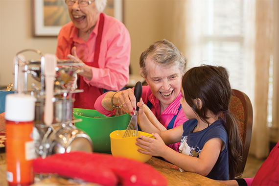 Elderly lady playing with child