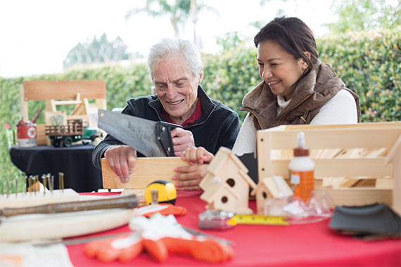 Elder man making crafts