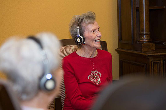 Resident using wireless headphones