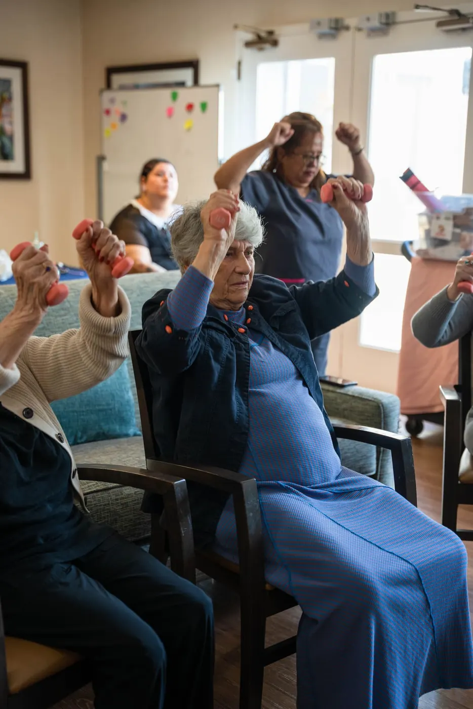 Seated exercise class with hand weights