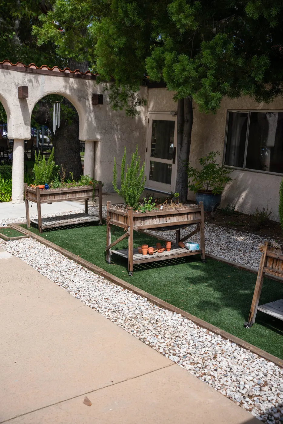 A planted courtyard walkway between buildings