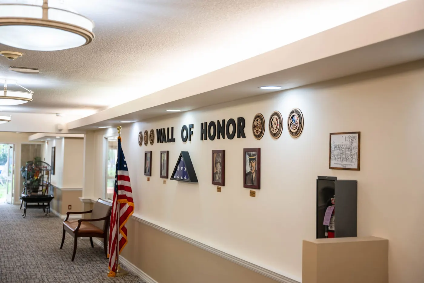 The Wall of Honor display along a resident corridor