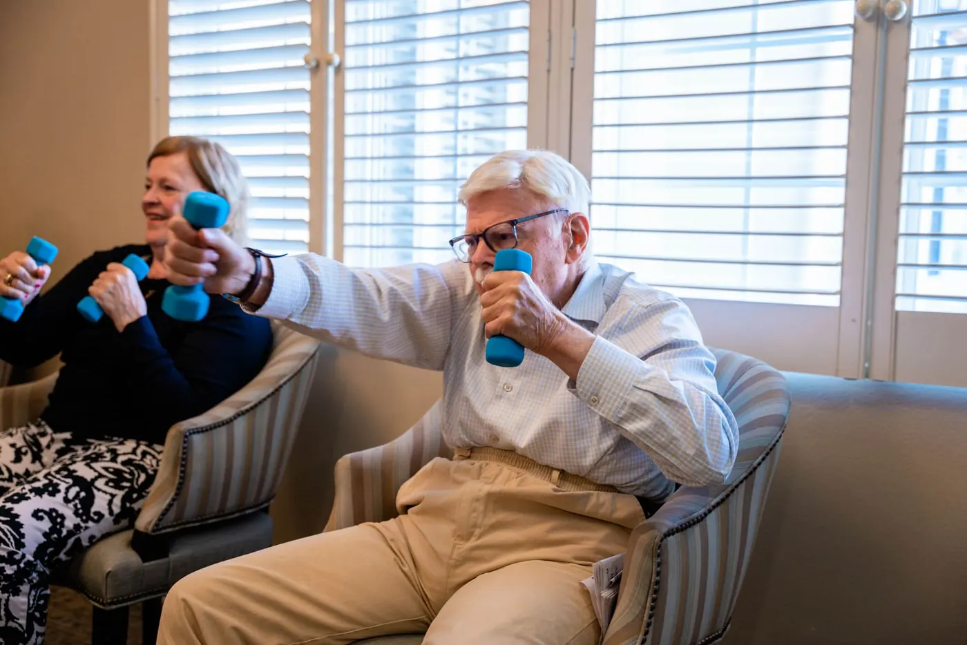 Partners in the seated exercise class