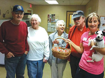 Residents donating gift baskets to dogs
