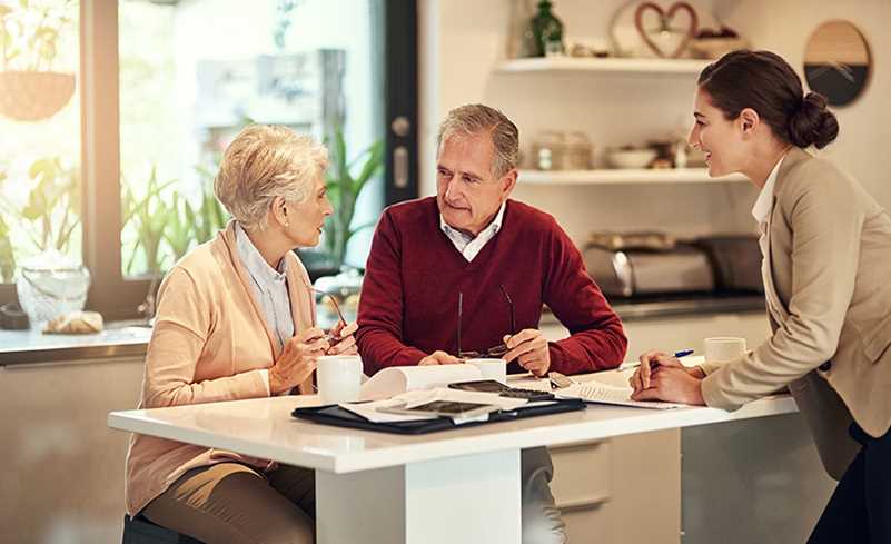 Elderly couple discussing financial options