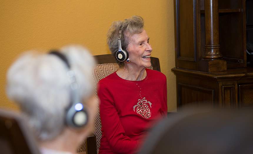 Resident listening to eversound headphone system