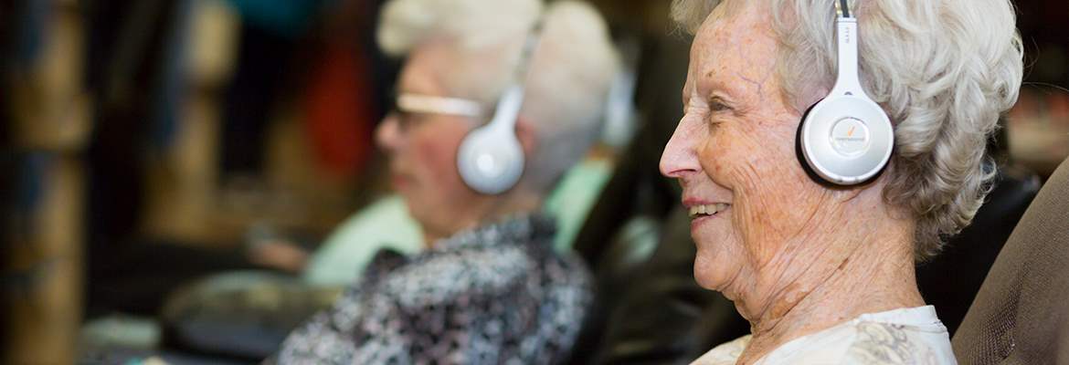 Residents using Eversound headphone system