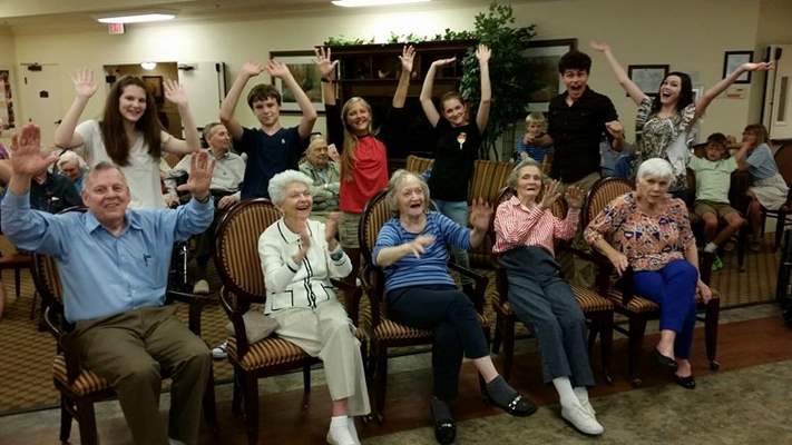 Residents cheering Improve troupe