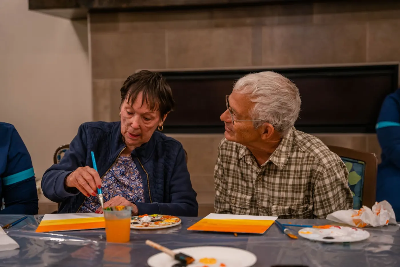 Conversation over canvases at the art table