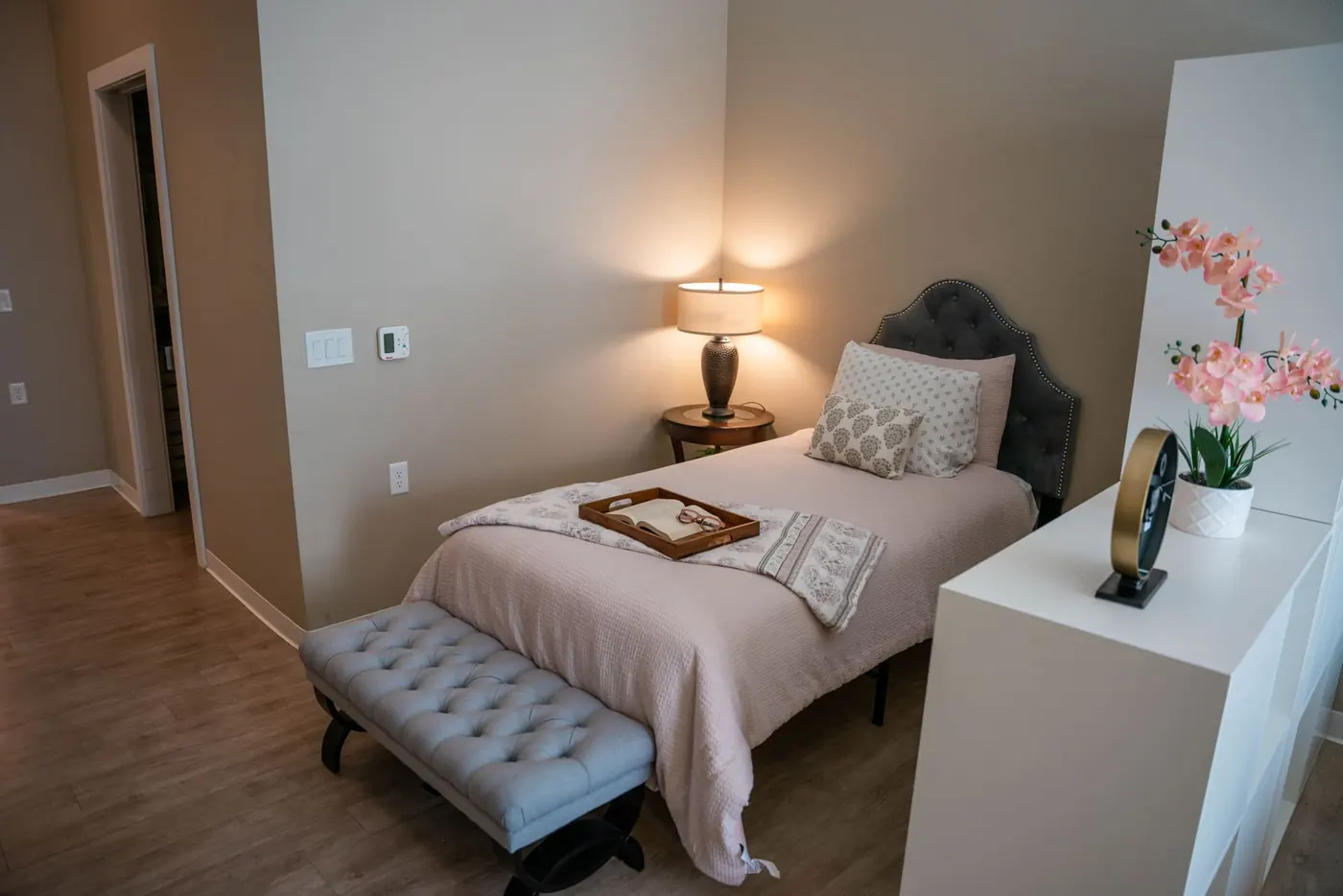 A resident bedroom with a window seat
