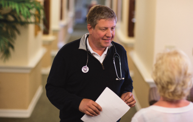 Doctor assisting patient