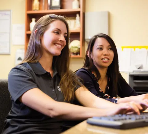 Silverado staff members at computer
