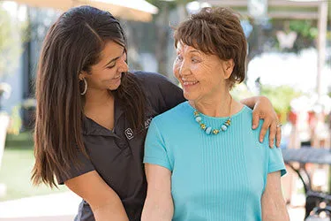 resident smiling with silverado staff member