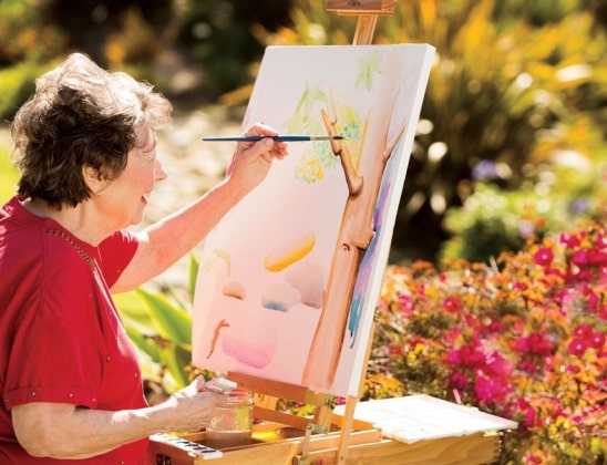 Resident painting at art activity